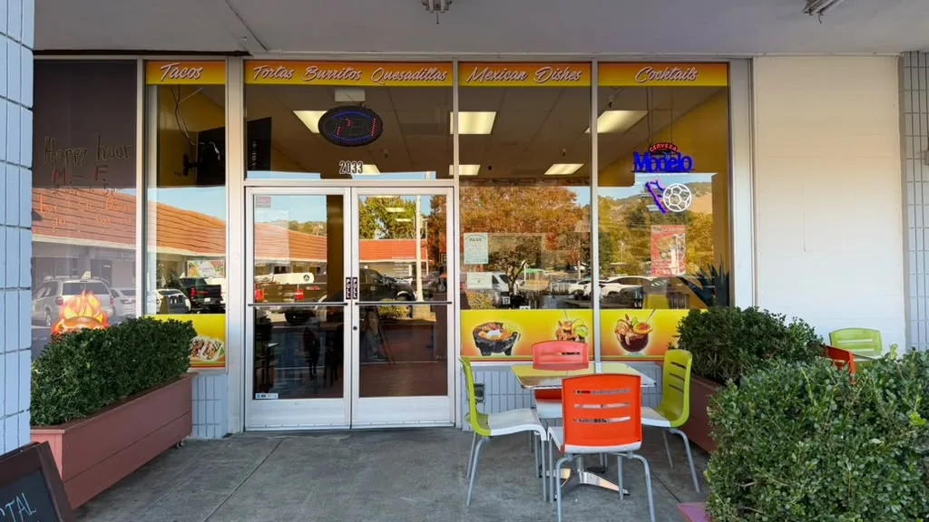 Restaurant front with patio tables